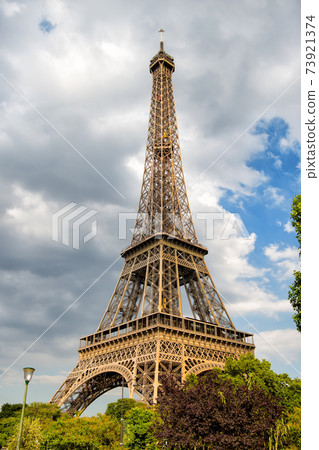 Eiffel Tower at sunset in Paris, France. Romantic travel background. Eiffel Tower at sunset in Paris, France. Romantic travel background. 73921374
