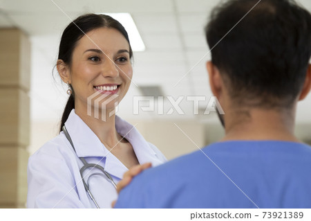smiling female doctor helping support and reassuring patient after cancer surgical treatment recovery. medical and healthcare concept. smiling female doctor helping support and reassuring patient after cancer surgical treatment recovery. medical and healthcare concept. 73921389
