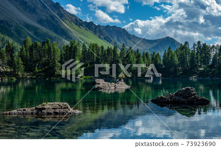 Lake Saoseo in Grisons, Switzerland: Beautiful reflections of mountains and sky Lake Saoseo in Grisons, Switzerland: Beautiful reflections of mountains and sky 73923690
