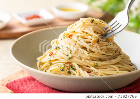 Spaghetti Peperoncino scooped with a fork Spaghetti Peperoncino scooped with a fork 73927769