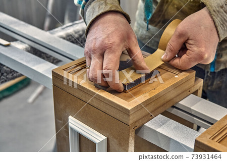 Joinery. Preparation furniture parts for painting in painting chamber. Production of wood furniture. Furniture manufacture. Joinery. Preparation furniture parts for painting in painting chamber. Production of wood furniture. Furniture manufacture. 73931464