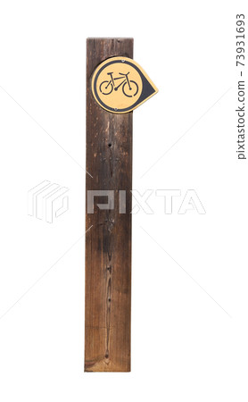 Wooden post with indication of bicycle route Wooden post with indication of bicycle route 73931693