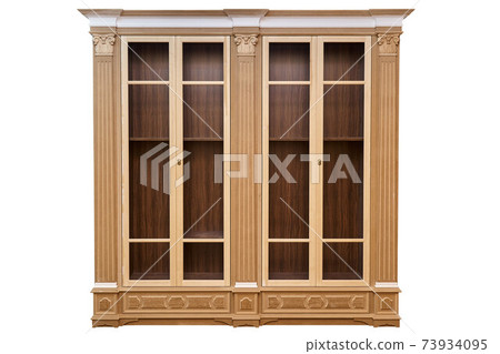 Bookcase. Mdf cabinet carcass with moldings and wooden carved capital on a white background. Work in progress 73934095