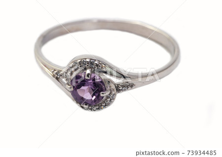 Beautiful silver ring with purple gemstone isolated on white background 73934485