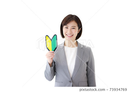 Female employee with a beginner mark 73934769