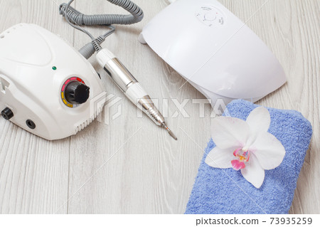 Set of cosmetic tools on a gray wooden background. Set of cosmetic tools on a gray wooden background. 73935259