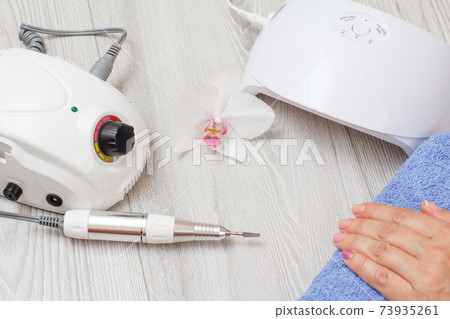 Set of cosmetic tools on a gray wooden background. Set of cosmetic tools on a gray wooden background. 73935261