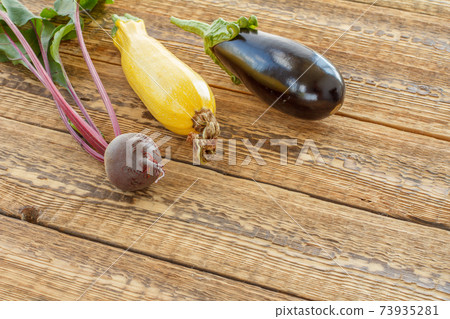 Just picked vegetables on old wooden boards. 73935281