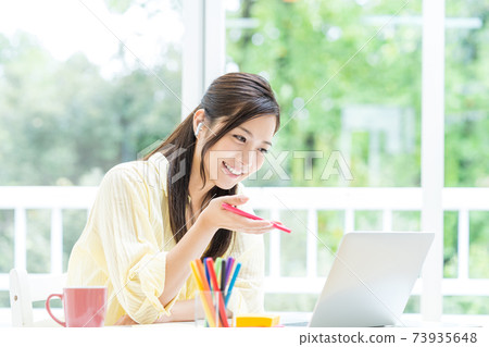 Students taking remote lessons at home Students taking remote lessons at home 73935648