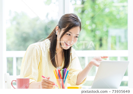 Students taking remote lessons at home Students taking remote lessons at home 73935649