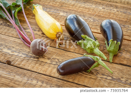 Just picked vegetables on old wooden boards. Just picked vegetables on old wooden boards. 73935764
