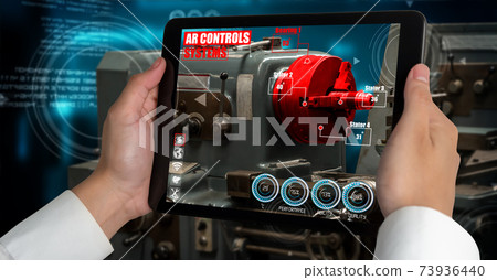 Engineer use augmented reality software in smart factory production line Engineer use augmented reality software in smart factory production line 73936440