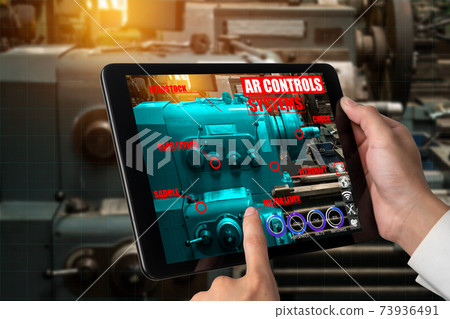 Engineer use augmented reality software in smart factory production line 73936491