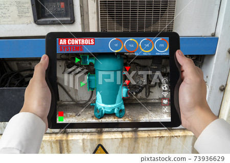 Engineer use augmented reality software in smart factory production line 73936629