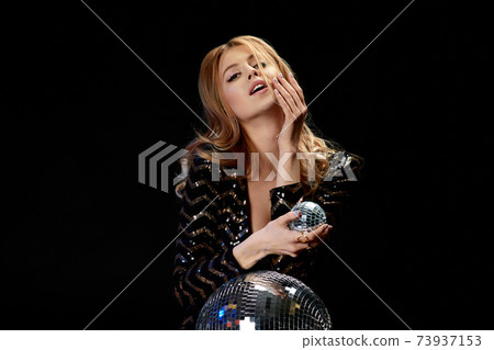 glamour model posing on near disco ball. 73937153