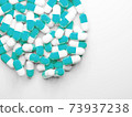 Photo material of a large number of capsules (medicines, supplements) with copy space 73937238