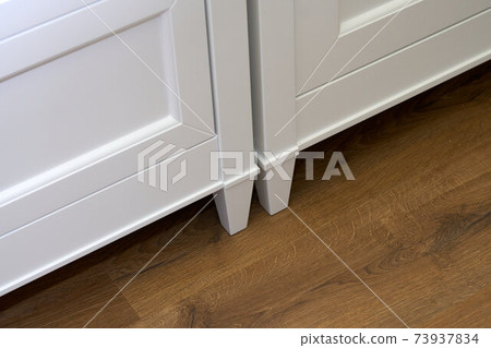 Kids wardrobe. Classic children's furniture in white color close-up 73937834