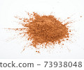 Pile cocoa powder on white background 73938048