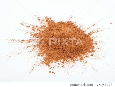Pile cocoa powder on white background 73938048