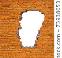 Broken hole in an old brick wall 73938053