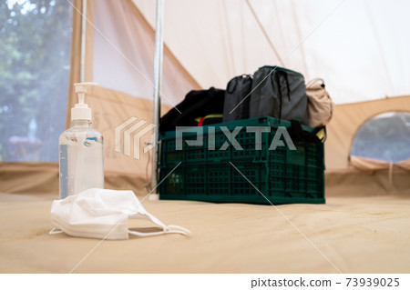 Vacation travel,holiday trip in new normal under COVID-19 concept,Protective face mask,alcohol antiseptic gel in the tent,hand sanitizer for cleaning hand to kill Coronavirus,health care,safe travels Vacation travel,holiday trip in new normal under COVID-19 concept,Protective face mask,alcohol antiseptic gel in the tent,hand sanitizer for cleaning hand to kill Coronavirus,health care,safe travels 73939025