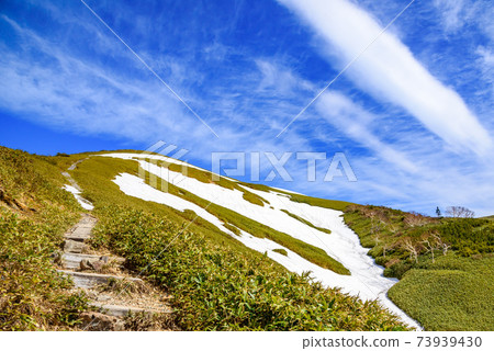 Tairapyoyama mountain trail with spring snow and clear sky Tairapyoyama mountain trail with spring snow and clear sky 73939430