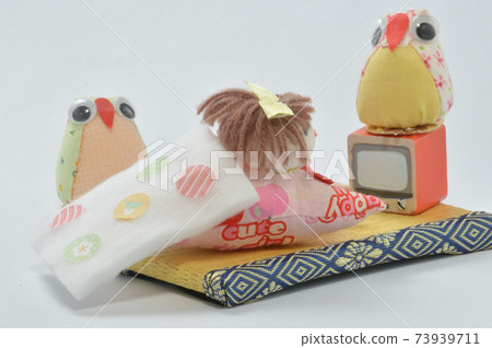 Doll watching tv Doll watching tv 73939711