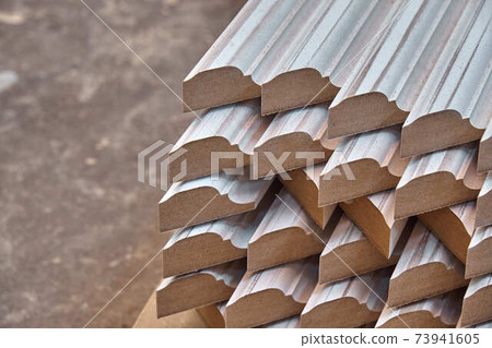 Joinery. Wood door manufacturing process. Stacked door moldings. Furniture manufacture 73941605