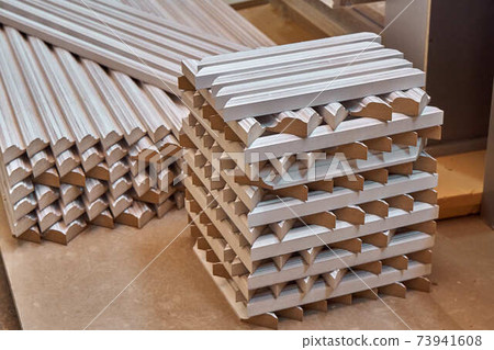 Joinery. Wood door manufacturing process. Stacked door moldings. Furniture manufacture 73941608