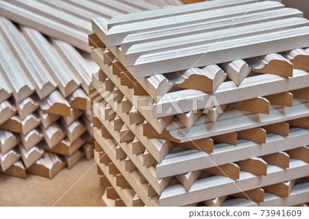 Joinery. Wood door manufacturing process. Stacked door moldings. Furniture manufacture 73941609