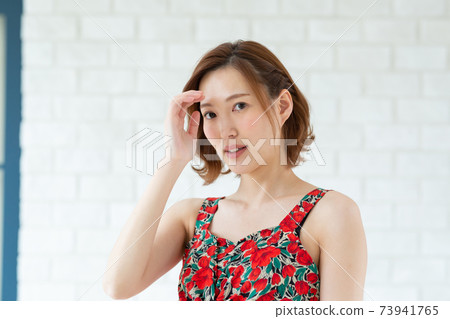 Cute woman in a dress Cute woman in a dress 73941765