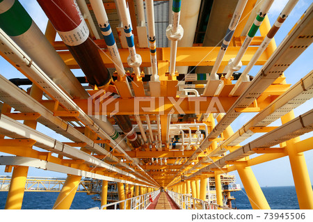 Offshore construction platform for production oil and gas. Oil and gas industry and hard work. Production platform and operation process by manual and auto function from control room. Offshore construction platform for production oil and gas. Oil and gas industry and hard work. Production platform and operation process by manual and auto function from control room. 73945506