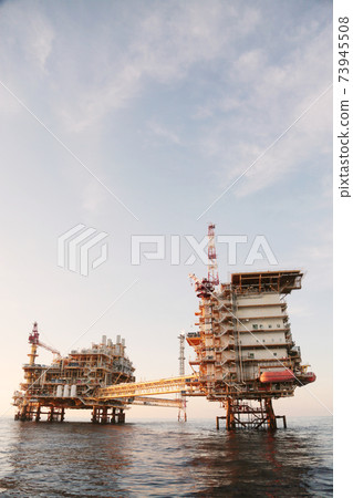 Offshore construction platform for production oil and gas. Oil and gas industry and hard work. Production platform and operation process by manual and auto function from control room. 73945508