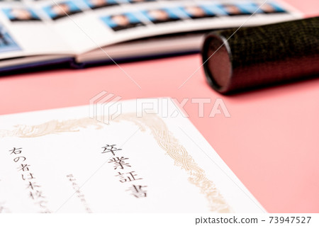 Diploma, round tube and graduation album 73947527