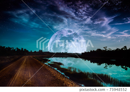 Landscape of sky with supermoon, many stars. Serenity background. 73948552