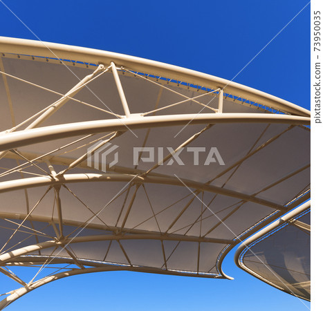 Modern Tensile Structure on a Clear Blue Sky - Photography 73950035