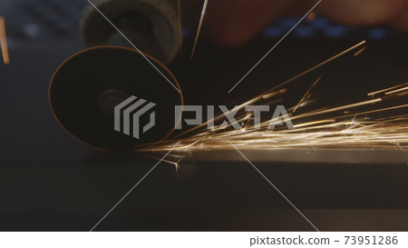 Steel cutter with sparks while cutting steel bar Steel cutter with sparks while cutting steel bar 73951286