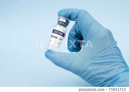 Vaccine against coronavirus, covid-19 concept. on a blue background. copy space, banner Vaccine against coronavirus, covid-19 concept. on a blue background. copy space, banner 73951715