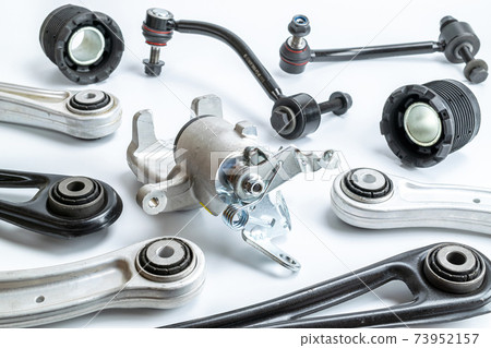 Spare parts. Auto motor mechanic spare or automotive piece on white background. Set of new metal car part. Automobile engine service. Spare parts. Auto motor mechanic spare or automotive piece on white background. Set of new metal car part. Automobile engine service. 73952157