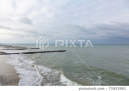 Gloomy Baltic Sea in winter season Gloomy Baltic Sea in winter season 73953991