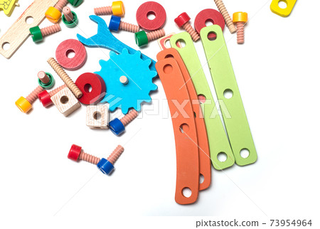 Closeup of colorful wooden construction toy on white background 73954964