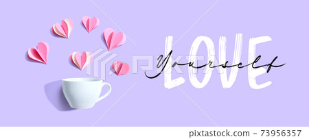 Love Yourself message with a coffee cup and paper hearts 73956357