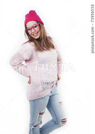 young pretty stylish hipster girl posing emotional isolated on white background happy smiling cool smile, lifestyle people concept 73956558