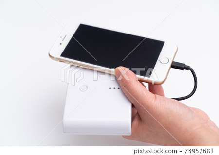 A female mobile battery that charges a smartphone A female mobile battery that charges a smartphone 73957681