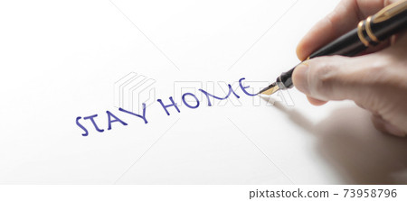 Hand writing the message of STAY HOME Hand writing the message of STAY HOME 73958796