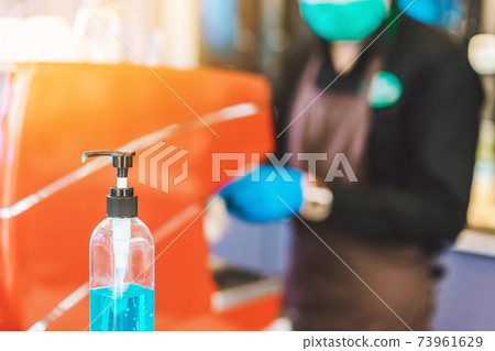 Blue alcohol gel bottle for hands cleaning to prevent the spreading of the Corona virus (Covid-19), Place the entrance service for customers in the cafe. Healthcare concept. New normal lifestyle. Blue alcohol gel bottle for hands cleaning to prevent the spreading of the Corona virus (Covid-19), Place the entrance service for customers in the cafe. Healthcare concept. New normal lifestyle. 73961629