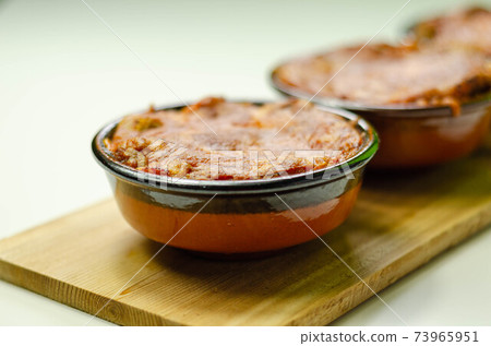 Traditional french onion gratin soup served in a ceramic bowl on a wood Traditional french onion gratin soup served in a ceramic bowl on a wood 73965951
