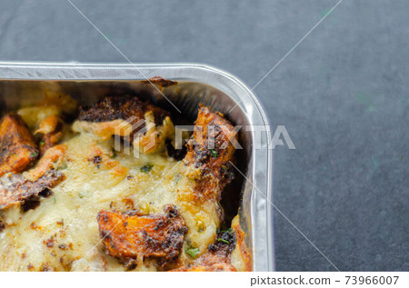 Fried potato fries coated topped with mature cheddar and Monterey Jack cheeses, jalapeno and bacon sauce, finished with mozzarella and parsley Fried potato fries coated topped with mature cheddar and Monterey Jack cheeses, jalapeno and bacon sauce, finished with mozzarella and parsley 73966007