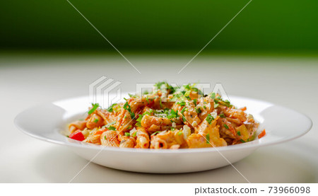 Piri piri style chicken on a bed of wholewheat pasta and vegetables, with a cool sour cream and chive dressing Piri piri style chicken on a bed of wholewheat pasta and vegetables, with a cool sour cream and chive dressing 73966098