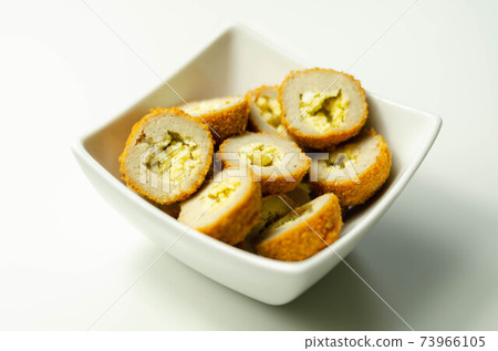 Savory mini scotch eggs in white ceramic bowl, traditional English snack Savory mini scotch eggs in white ceramic bowl, traditional English snack 73966105